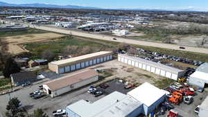 Aerial view of industrial structures and a mountain backdrop