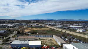 Bird's eye view of an industrial area and a mountainous background