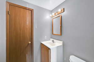 Half bath with toilet and vanity