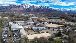 Drone / aerial view of a mountainous background and industrial structures