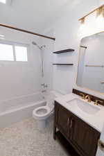 Bathroom featuring vanity and shower / washtub combination
