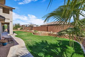 Fenced backyard featuring a patio