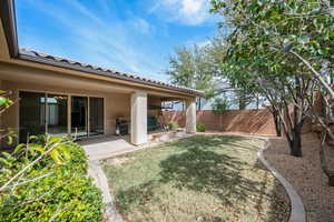 Fenced backyard with a patio area