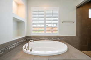 Bathroom featuring a garden tub