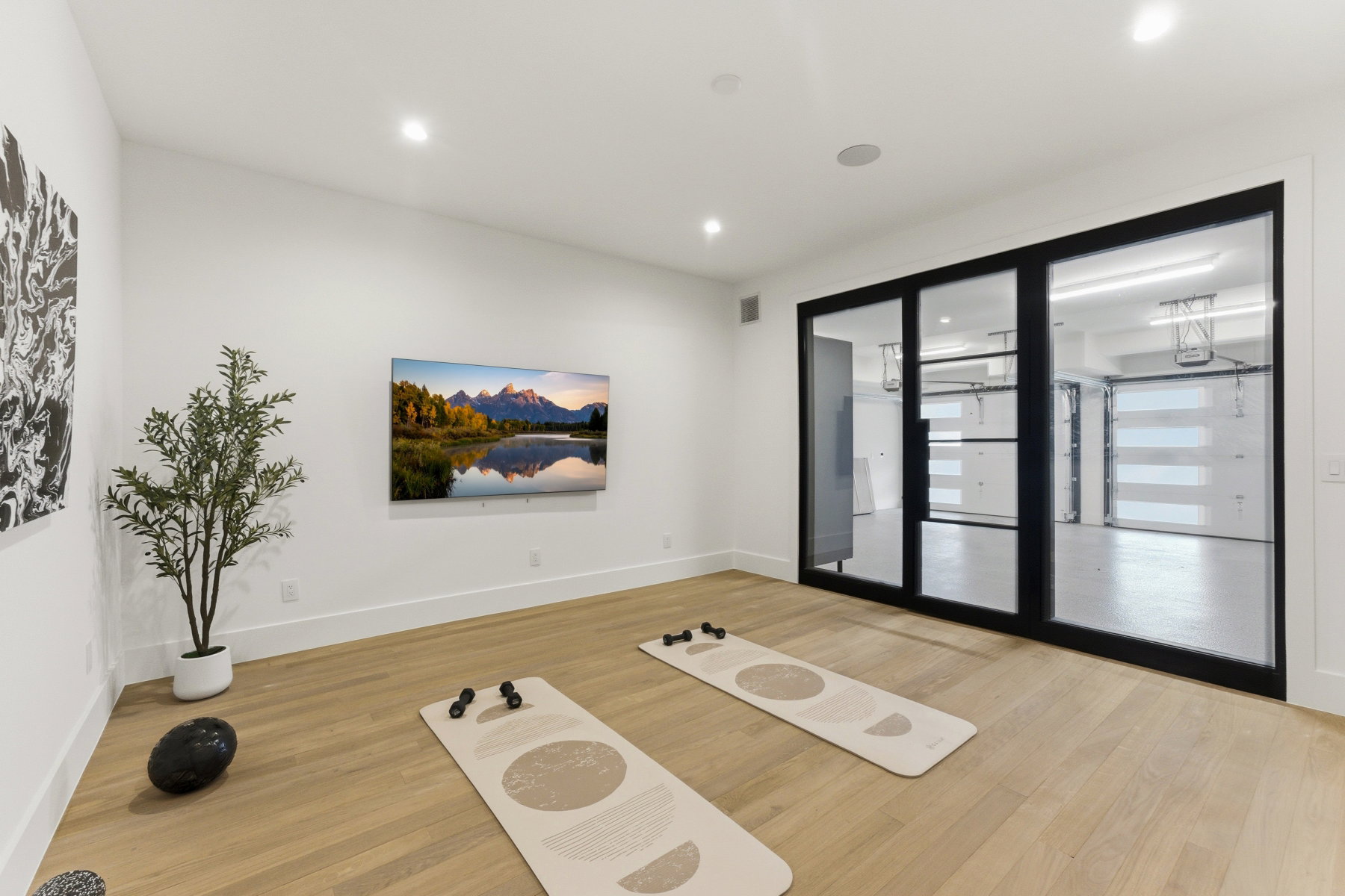 Room featuring light wood-finish flooring, recessed lighting, and white baseboards