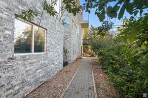 View of home's (basement entrance) exterior with brick siding