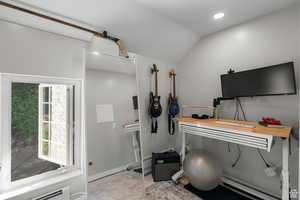Miscellaneous room (closet/office/nursery) featuring a baseboard heating unit
