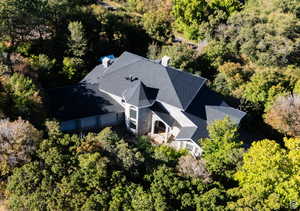 View of subject property featuring a forest