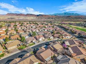 Aerial perspective of suburban area featuring a mountain backdrop