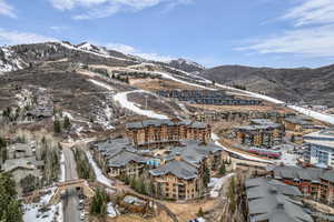 Snowy aerial view featuring a mountain view
