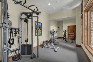 Exercise area with recessed lighting and attic access