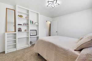 Bedroom featuring carpet