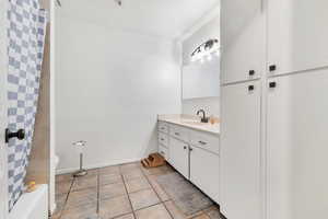 Bathroom featuring vanity and light tile patterned flooring