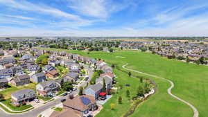 Aerial perspective of suburban area featuring a golf club