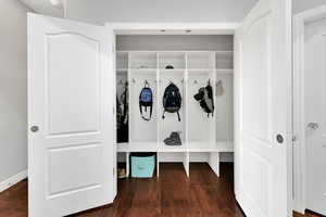 Mudroom with dark wood-style floors