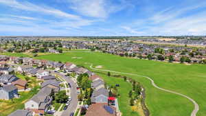 Aerial perspective of suburban area featuring a golf course