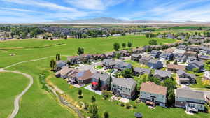 Aerial perspective of suburban area with a mountain backdrop