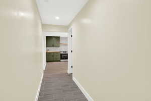 Hallway featuring baseboards and recessed lighting