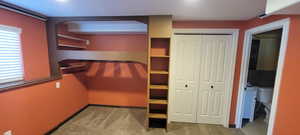 Walk in closet featuring light carpet