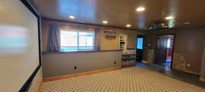 Unfurnished room featuring recessed lighting and dark wood-style flooring