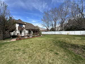 Fenced backyard featuring a wooden deck