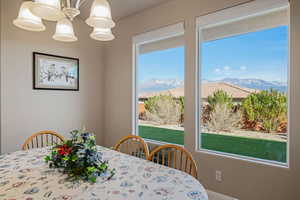 Dining space featuring a mountain view and hanging lights