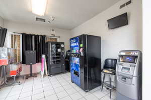 Kitchen featuring fridge and freestanding refrigerator
