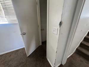 Detailed view of carpet floors and baseboards