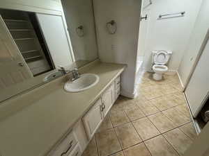 Bathroom featuring vanity and light tile patterned floors