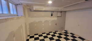 Basement with light flooring