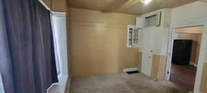 Empty room featuring light carpet