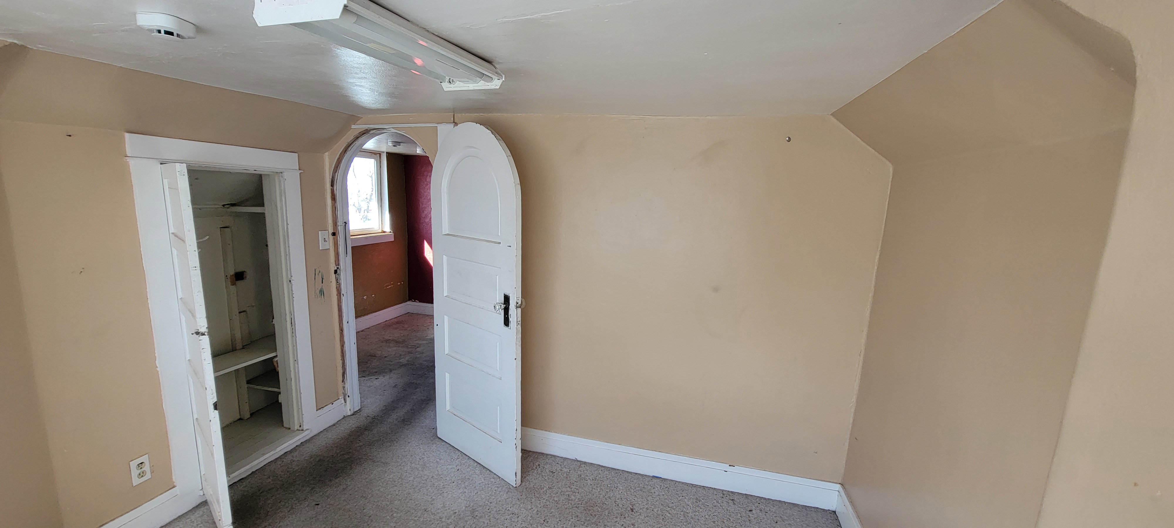 Bonus room featuring baseboards and carpet floors