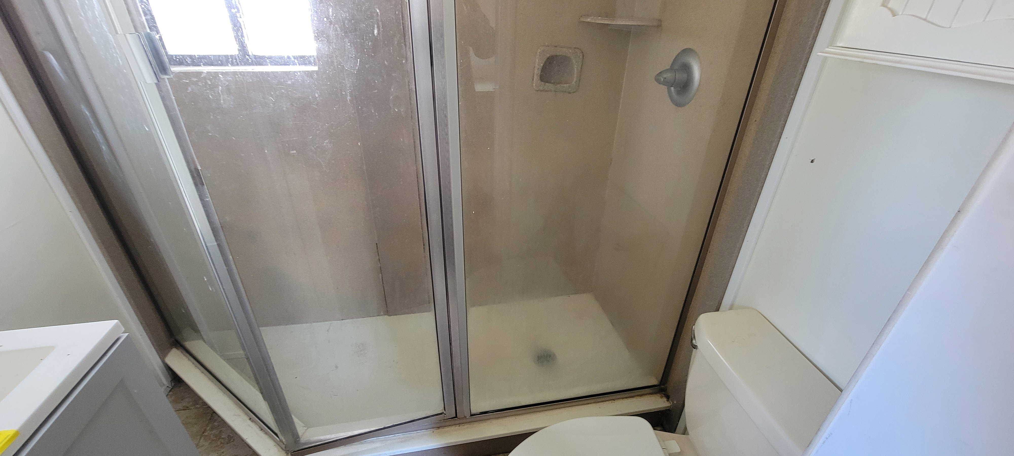 Full bath with vanity and a stall shower
