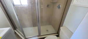 Full bath with vanity and a stall shower