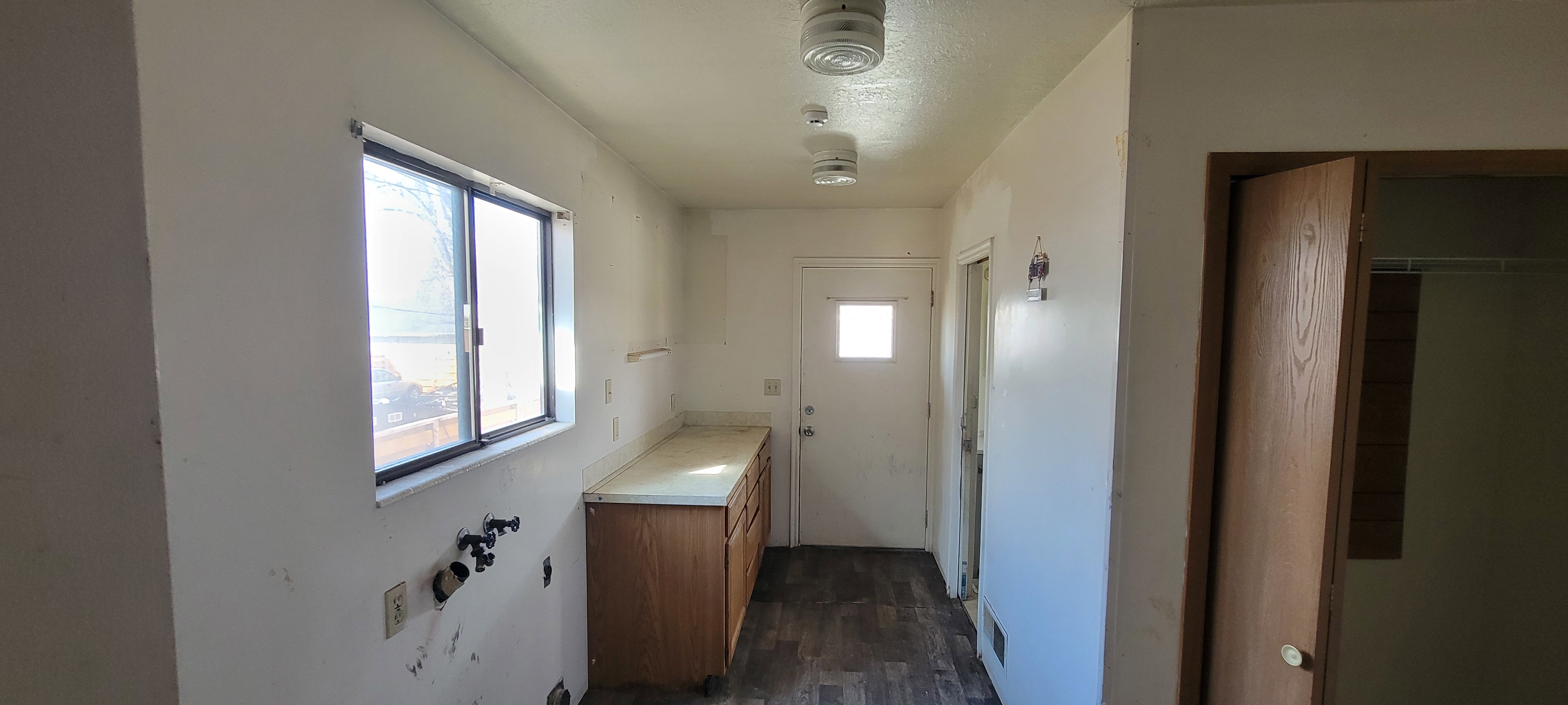 Bathroom featuring dark wood-type flooring and vanity