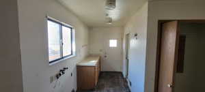 Bathroom featuring dark wood-type flooring and vanity
