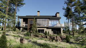 Rear view of house featuring a balcony, a chimney, and stone siding