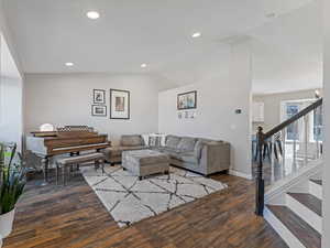 Living area with Vaulted Ceilings, LVP Flooring & Recessed Lighting