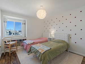Bedroom with LVP Floors, & Bookshelves