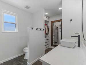 Main Ensuite bathroom and a spacious his and hers closet