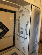 Bathroom featuring a shower stall