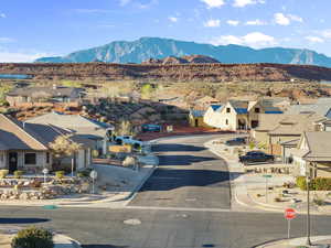 View of mountain background featuring nearby suburban area