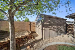 View of shed featuring a fenced backyard
