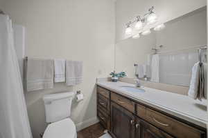 Bathroom with vanity and curtained shower