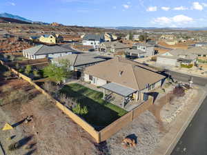 Aerial view of residential area featuring a mountain backdrop