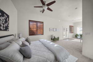 Bedroom featuring access to outside, carpet flooring, ceiling fan, a textured ceiling, and french doors