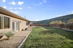Fenced backyard featuring a patio area