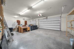 Garage with freestanding refrigerator