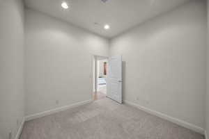 Unfurnished room featuring light colored carpet and recessed lighting