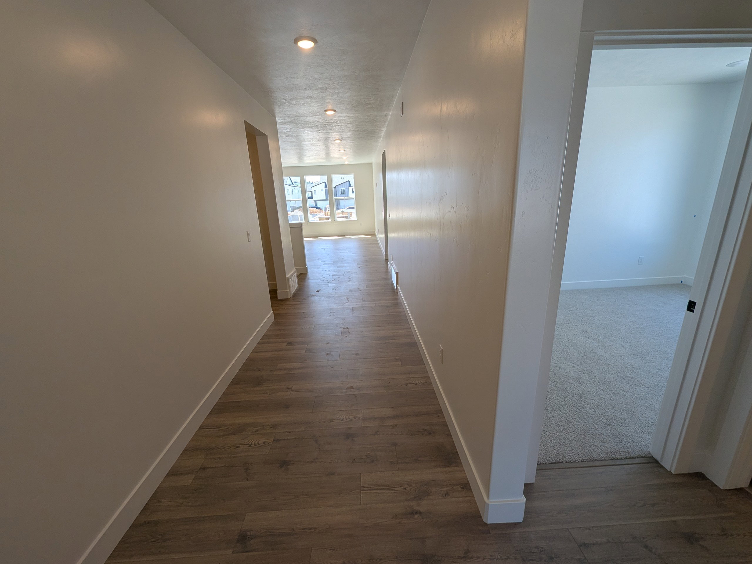 Corridor with dark wood-type flooring